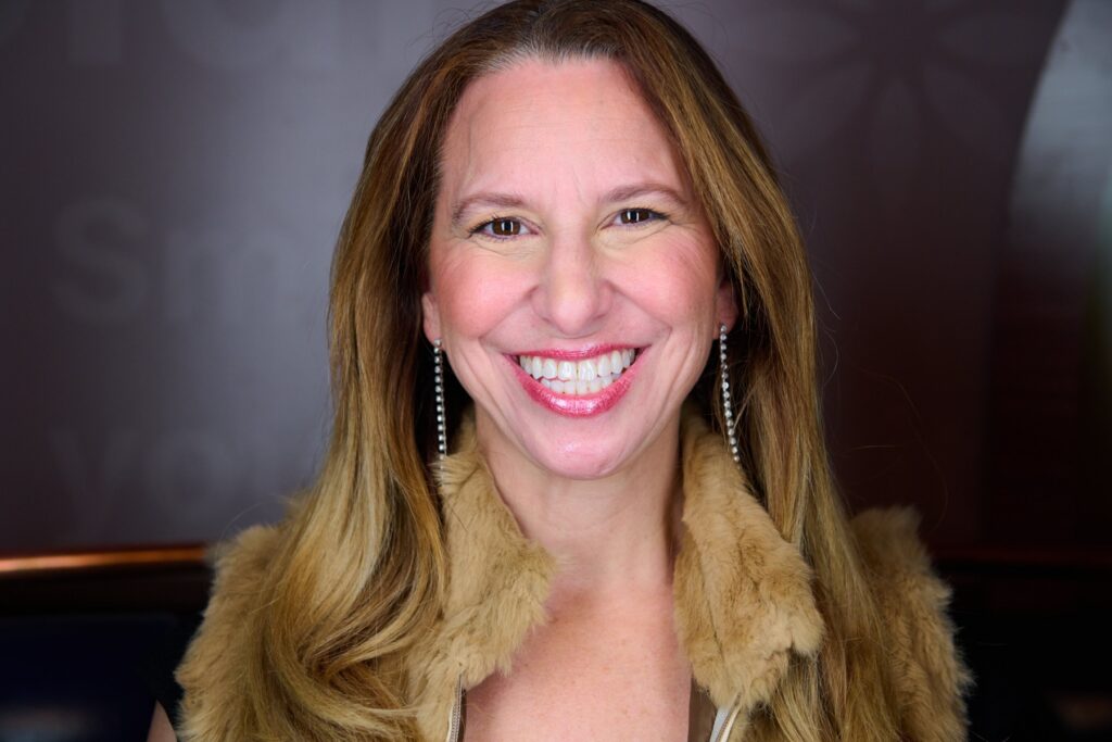 Joanna Poppper headshot. Woman smiling.